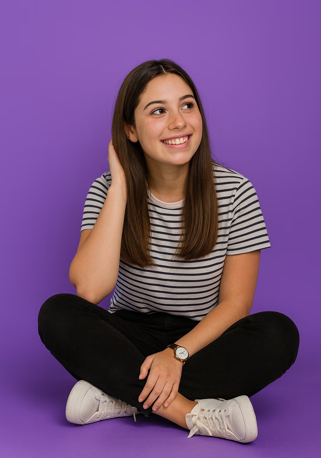 Babysitter sitting cross-legged and smiling